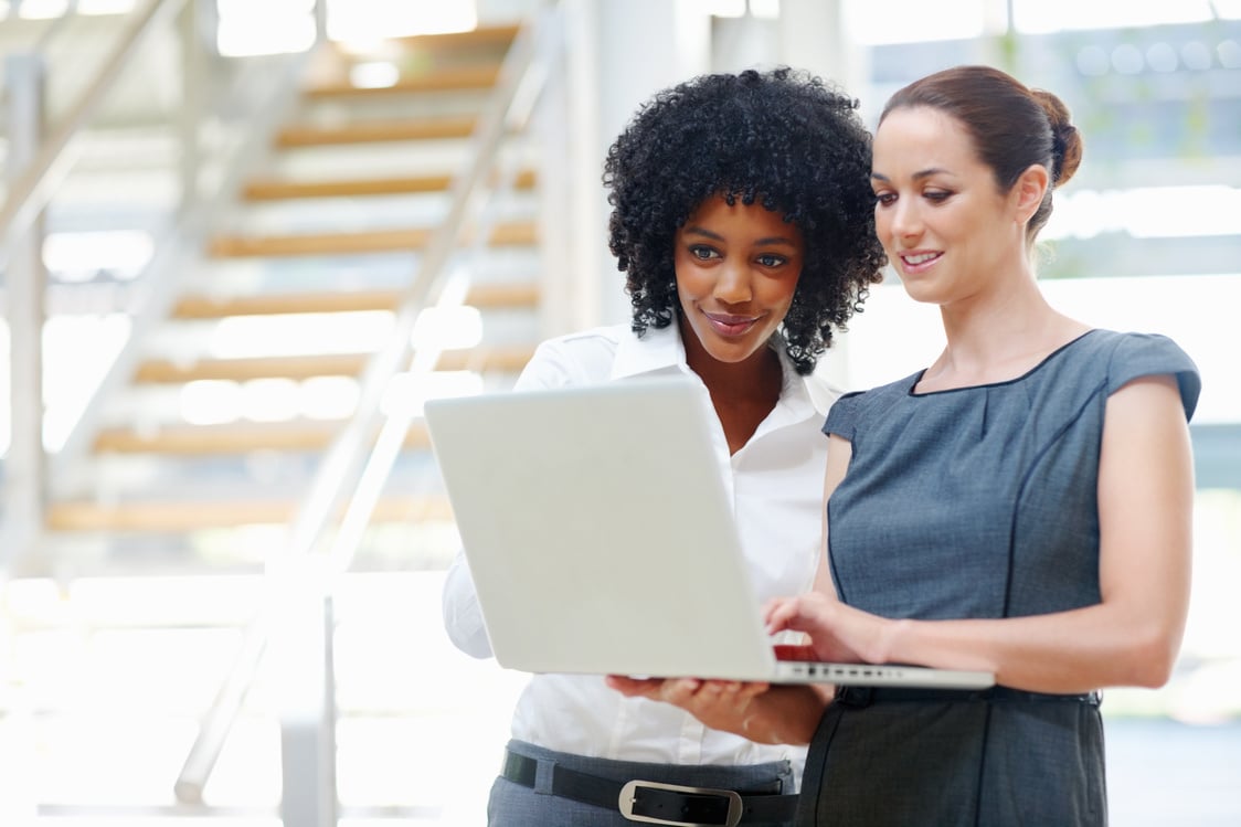 Two business women using laptop